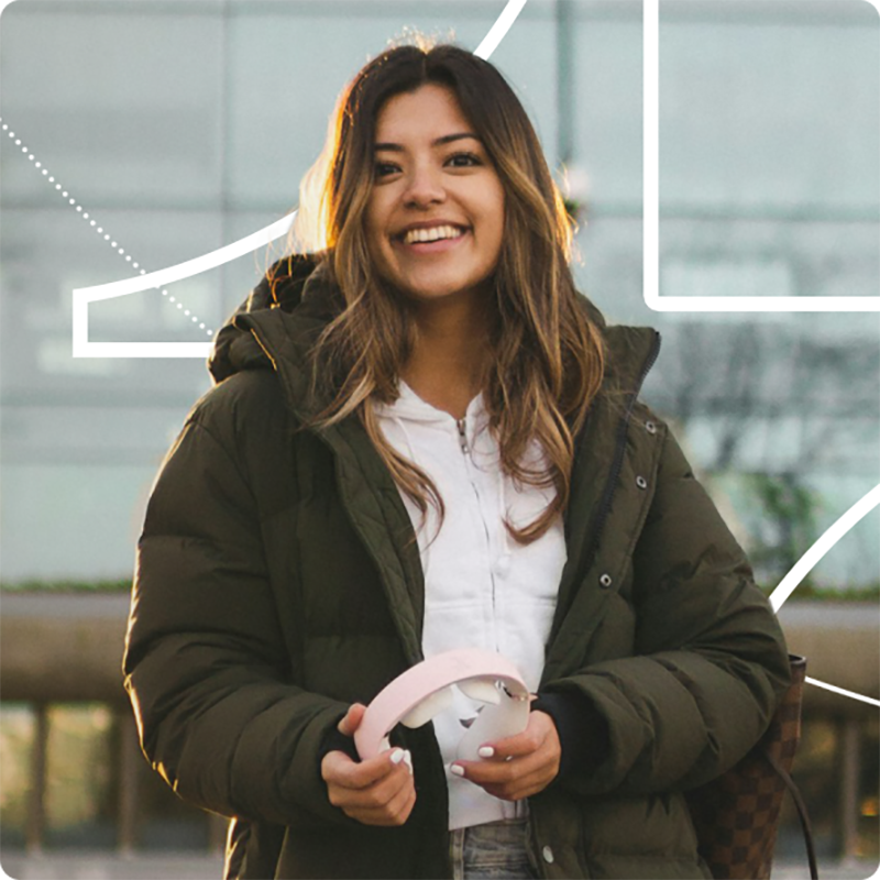 Student with headphones in her hands